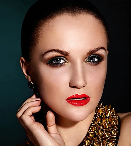 High fashion look.glamor closeup portrait of beautiful sexy brunette Caucasian young woman model with healthy hair,bright makeup, with red lips,  with perfect clean skin with accessory jewelery